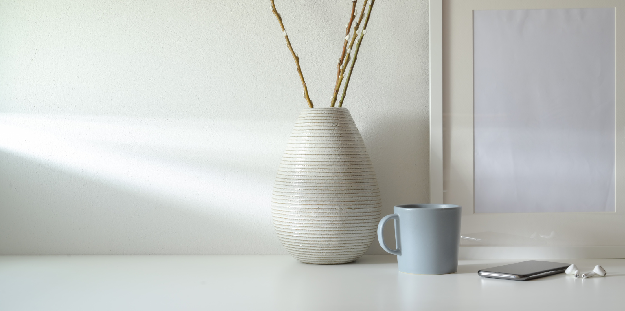 White Ceramic Vase  Near Coffee Cup